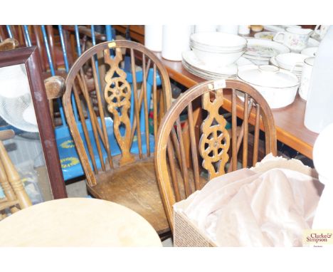 Two stick and wheel back dining chairs