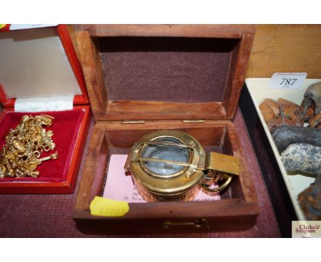 A reproduction Mark III 1942 style brass compass