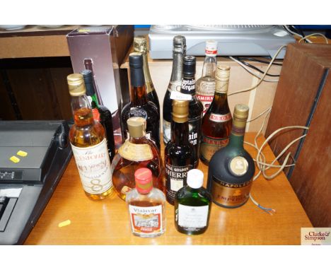 A collection of alcohol to include; bottle of Dimple whiskey, Captain Morgan rum, Scotch malt whiskey etc.