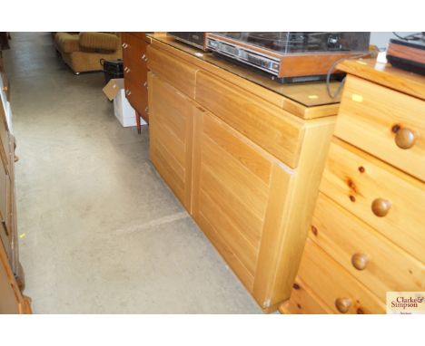 A modern light oak sideboard