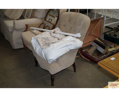 A button back upholstered armchair