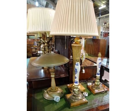 Table lamps, comprising; a large giltwood fluted table lamp, a pair of table lamps formed from beer pumps and a patinated met