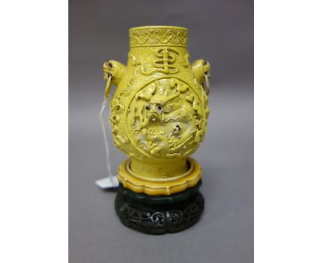 A Chinese spinach jade and ivory mounted small stand, 19th century, the jade pierced and carved with foliate panels within a 