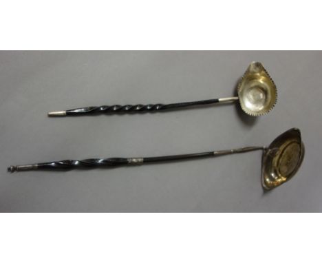 A George III silver toddy ladle, the oval bowl decorated with a reeded rim, London 1798, fitted with a twisted whalebone hand