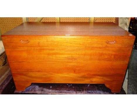 A 20th century camphor wood trunk, 102cm wide x 52cm high.  Dis