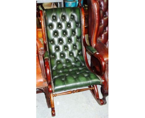 A Victorian style mahogany green button upholstered rocking chair.  H4