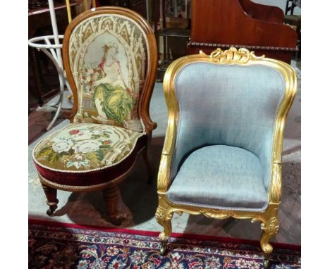 A Victorian gilt framed child's low armchair on scroll supports, together with a Victorian walnut framed spoon back nursing c