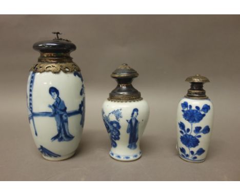 Three Chinese blue and white vases with later silver coloured metal mounts, the porcelain Kangxi, comprising; a  slender ovoi