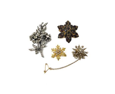 A gold and seed pearl set pendant brooch designed as a six pointed startburst, detailed '9C', fitted with a safety chain, a g