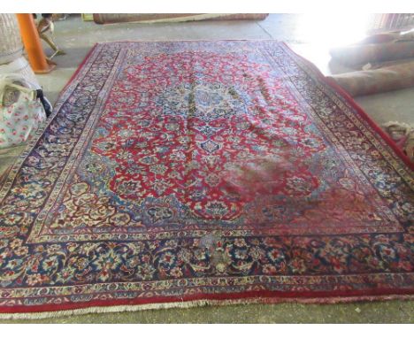 A Kashan carpet, Persian, 413cm x 274cm.  Please note that this lot is subject to VAT on the hammer