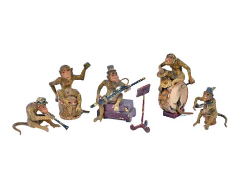 An Austrian cold painted bronze monkey band, early 20th century, comprising five monkeys playing various instruments with a s