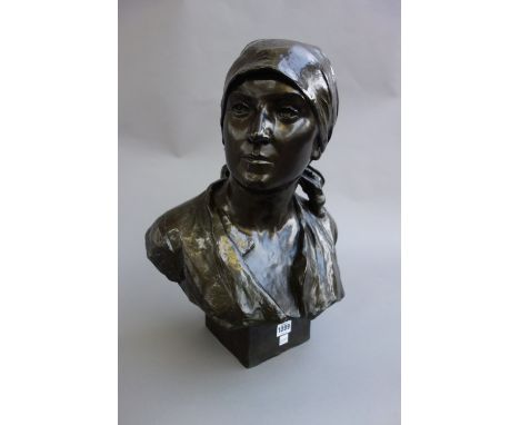 A Continental patinated bronze bust, early 20th century, depicting a young woman wearing a headscarf, indistinctly signed and