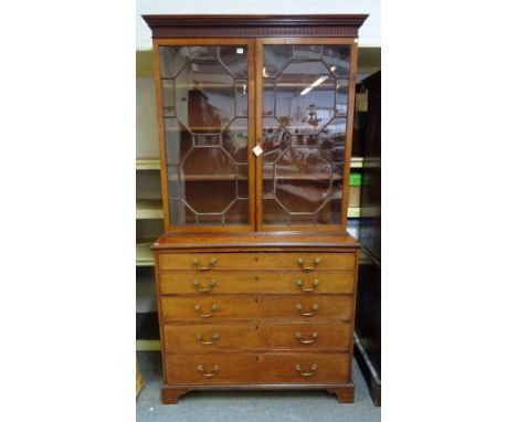 A George III mahogany bookcase chest, the pair of astragal glazed doors over fitted drawer and three long graduated drawers, 