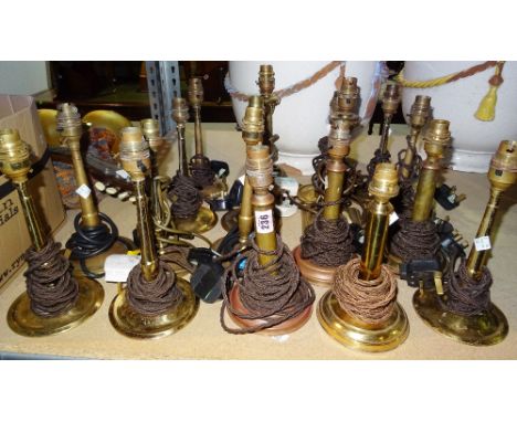 Eighteen 20th century brass table lamps, of candlestick form, (18).   S3
