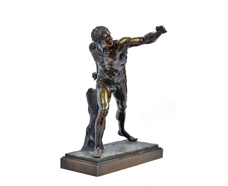 A patinated bronze figure of a Roman gladiator, late 19th century, modelled naked with his arm outstretched, on a naturalisti