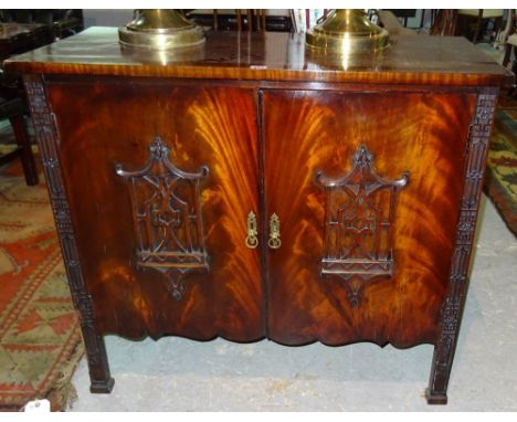 A mahogany two door side cabinet of Chinese Chippendale revival style, 100cm wide x 89cm high.  F6