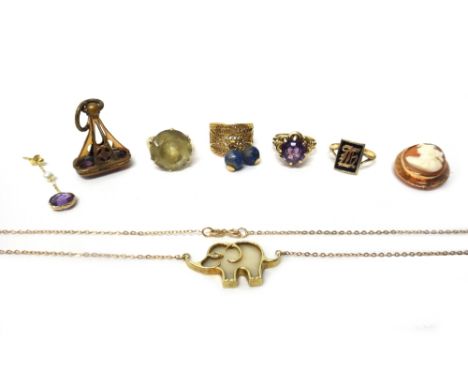 A gold filigree ring, fitted with two lapis lazuli pendant beads, a 9ct gold ring, claw set with a circular cut amethyst, a 9