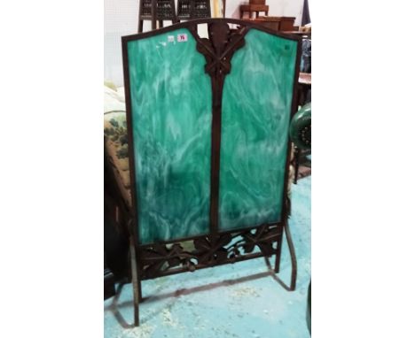 A French Art Nouveau wrought iron fire screen with inset faux hardstone panels, of foliate rectangular form on shaped support