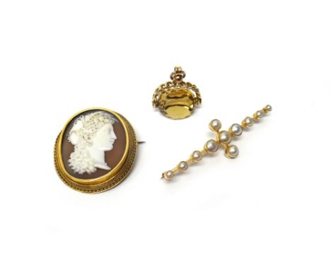 A Victorian gold mounted oval shell cameo brooch, carved as a Classical portrait, a gold and half pearl set brooch and a 9ct 