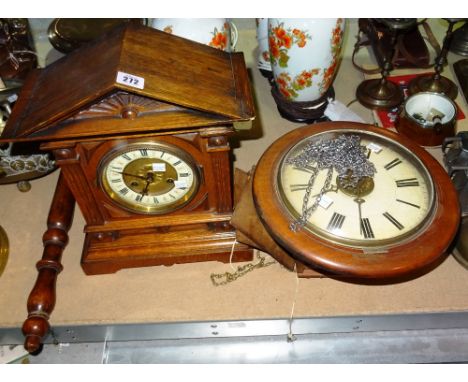 An early 20th century  Winterhalder and Hofmeier German oak metal clock and a postman's alarm wall clock, (2).  S2