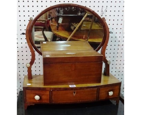 A George III mahogany oval toilet mirror,on a bowfronted base over three frieze drawers, 52cm wide x 53cm high and a Victoria