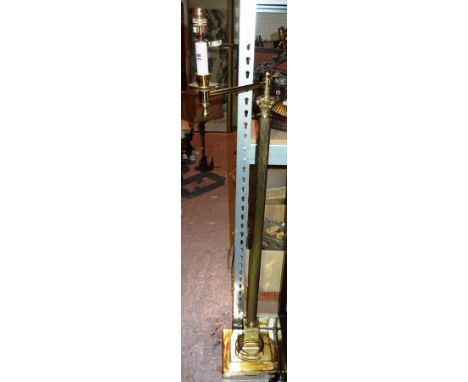 A 20th century brass adjustable standard lamp of Corinthian column form. 114cm wide.  I3