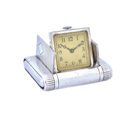 A silver rectangular cased folding purse watch, the square dial with black Arabic numerals and detailed 'Swiss Made', the cas