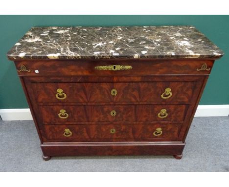 An early 19th century French gilt metal mounted mahogany commode, the marble top over four long graduated drawers, 123cm wide