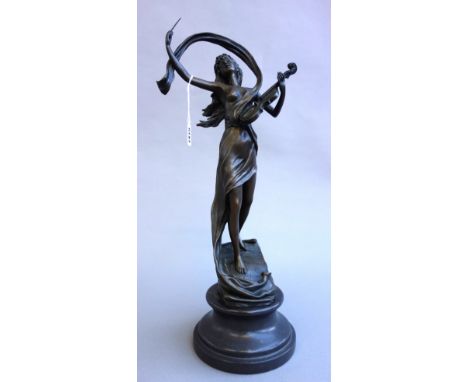 An Art Nouveau style modern bronze figure, modelled and cast as a semi-nude figure playing a violin, raised atop a turned cir