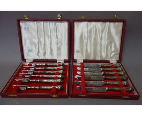 A set of six King's pattern tea knives having loaded silver handles and steel blades, cased, a set of six King's pattern tea 