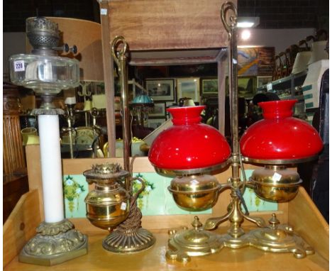 A Victorian gilt brass twin oil lamp and three further oil lamps, (4).  I6