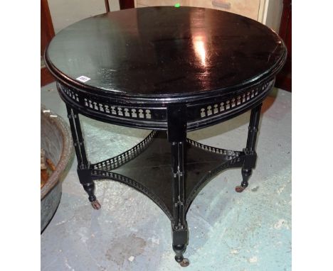 A Chippendale style ebonised circular occasional table, on cluster column supports, 73cm wide x 75cm high.  D3