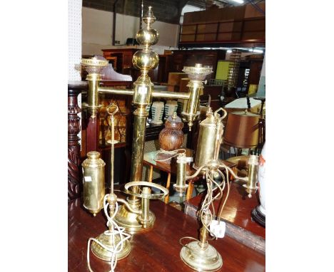 A large Colza style brass dual oil lamp and two further brass oil lamps, all later converted for electricity, (3).  G5