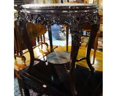 A 20th century Chinese Chippendale oval centre table, on outswept supports united by platform undertier, 78cm wide x 76cm hig