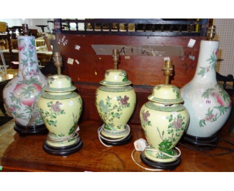 A pair of Asian ceramic table lamps, decorated with peaches and three further 20th century Asian decorated table lamps, (5). 