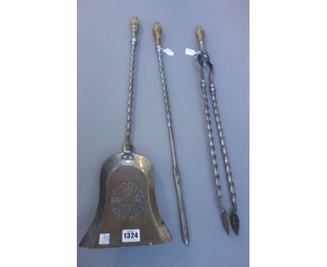 A set of three Victorian steel and brass mounted fire tools, with wrythen twist stem, the shovel with a pierced plate, 74.5cm