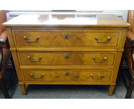 A Louis XVI style walnut and mixed wood three drawer commode, on tapering square supports, 113cm wide x 86cm high x 56cm deep