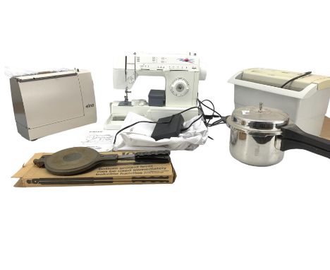 Singer electric sewing machine with instruction manual, Elna sewing machine, paper shredder, Jotul cookie press and a pressur
