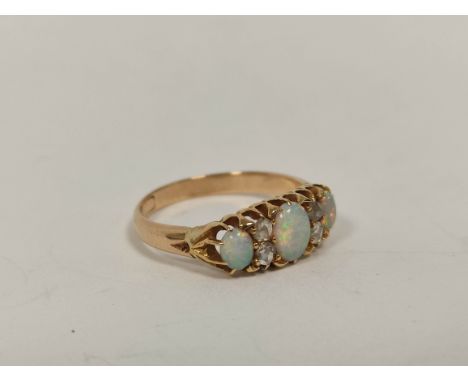 Gold ring with three opals and diamond points, probably 9ct. Size 'M'.&nbsp;Mount and shank good Opals have nice variegated c