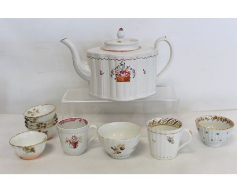 New Hall porcelain teapot of "silver" or "commode" shape, with painted decoration of a basket of flowers and sprigging, rim c