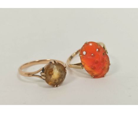 Citrine ring in gold '9ct' and another with carved carnelian. (2). 