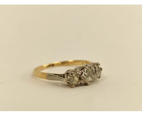 Diamond three stone ring with old cut brilliants, the largest approx. 4mm in gold and platinum. 