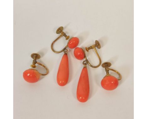Pair of coral drop earrings and another pair, buttons, in gold '9ct'.&nbsp;Drop is 20mm long excluding gold ring Coral appear
