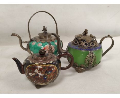 Three Chinese teapots to include one of green Peking glass with cloisonné banding and white metal lid with monkey finial. (3)