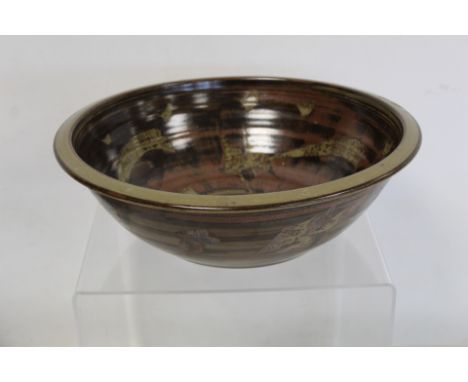 Harry and May Davis Crowan Cornish studio pottery bowl of circular form with tenmoku glaze and wax resist decoration, indisti