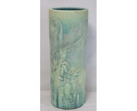 Large Bretby pottery cylindrical stick stand with moulded matt green drip glazed decoration of two scrolling dragons, impress