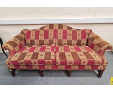 Mahogany upholstered scroll sofa raised on mahogany feet in red, brown and cream moquette. 90cm high, 206cm wide and 100cm de