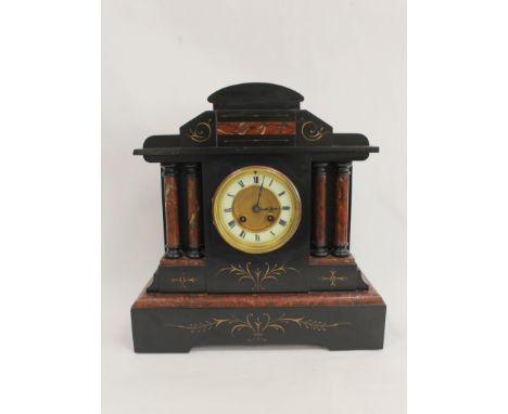 French rouge and black marble mantel clock of architectural form, with four columns. 37cm. 