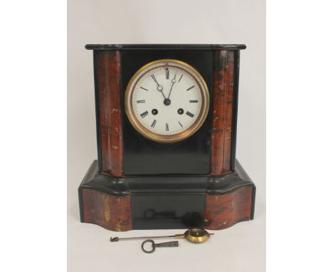French rouge and black marble mantel clock with shaped moulded sides and flat top. 16.5cm. 