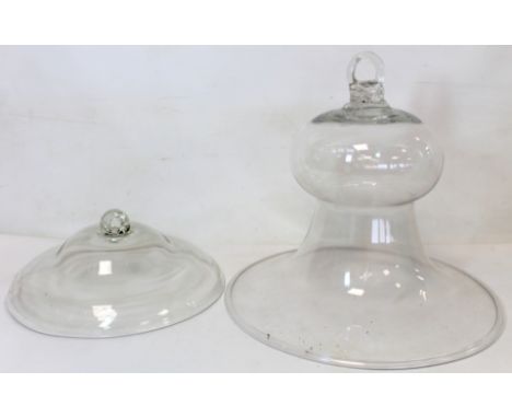 19th century glass bell jar cloche cover with ring handle, 27cm high, 31cm diam.; also another domed glass cover, 24.5cm diam